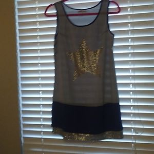 Gray with purple trim, silver sequin star on the front. Brand new.